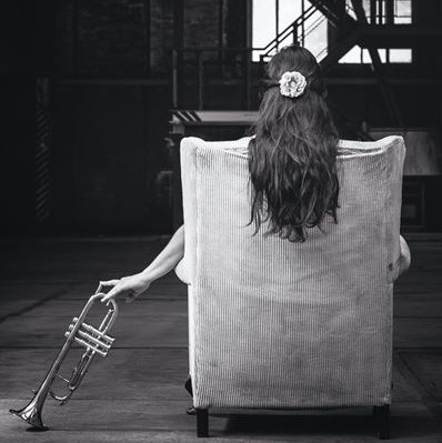 trumpet_woman_in_chair.jpg