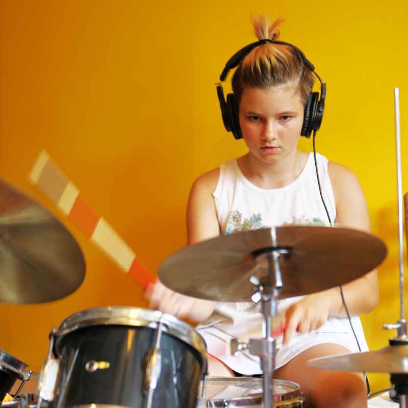 Young adult  learning to play drums in a private 1 on 1 drum lesson