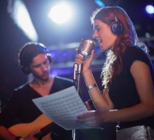 Female music student taking a voice lesson at The Lesson Studio in Boulder. 