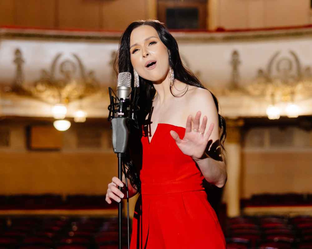 Adult female voice student from The Lesson Studio performing on stage